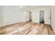 Spacious basement with stylish flooring, white walls, and multiple doors leading to other areas of the house at 20112 E Grand Pl, Aurora, CO 80015