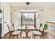 Cozy dining area with a bay window, perfect for enjoying meals with a view of the neighborhood at 20112 E Grand Pl, Aurora, CO 80015