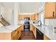 Contemporary kitchen with white countertops, stainless appliances and wood floors at 20112 E Grand Pl, Aurora, CO 80015