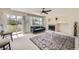 Bright living room with a fireplace, large window with sliding door, and stylish decor at 20112 E Grand Pl, Aurora, CO 80015