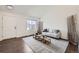 Cozy living room featuring hardwood floors and neutral decor at 20112 E Grand Pl, Aurora, CO 80015