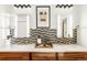 Luxurious bathroom with dual sinks, decorative tiles, and updated mirrors at 1700 Bassett St # 2216, Denver, CO 80202