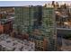 A modern high-rise apartment complex featuring sleek glass and brick accents at 1700 Bassett St # 2216, Denver, CO 80202