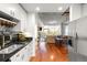 Open-concept living space with hardwood floors and amazing city views at 1700 Bassett St # 2216, Denver, CO 80202