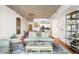 Open living space with modern decor, a kitchen view, and hardwood floors at 1700 Bassett St # 2216, Denver, CO 80202