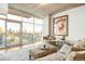 Cozy living room with a balcony showing skyline views at 1700 Bassett St # 2216, Denver, CO 80202