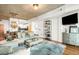 Open living space with modern decor, a kitchen view, and hardwood floors at 1700 Bassett St # 2216, Denver, CO 80202