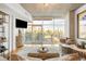 Modern living room with a large window offering city views and a balcony space at 1700 Bassett St # 2216, Denver, CO 80202