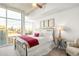 Bright bedroom boasts city views from expansive windows and a comfortable layout at 1700 Bassett St # 2216, Denver, CO 80202