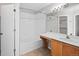 Bathroom featuring a combined tub and shower, vanity, mirror, and modern finishes at 3339 Blue Grass Cir, Castle Rock, CO 80109