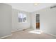 Neutral bedroom with natural light, plush carpeting, and an attached bathroom at 3339 Blue Grass Cir, Castle Rock, CO 80109