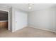 A bedroom with a ceiling fan, closet with sliding doors, and access to attic space at 3339 Blue Grass Cir, Castle Rock, CO 80109