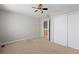 Bedroom features a ceiling fan, neutral carpet and a closet with sliding doors at 3339 Blue Grass Cir, Castle Rock, CO 80109