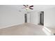 A large bedroom with a ceiling fan and several doorways to other rooms at 3339 Blue Grass Cir, Castle Rock, CO 80109