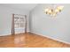 Bright dining room with hardwood floors, neutral walls, chandelier lighting, and a large window at 3339 Blue Grass Cir, Castle Rock, CO 80109