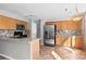 Updated kitchen with stainless steel appliances, tile floors, wooden cabinets, and ample counter space at 3339 Blue Grass Cir, Castle Rock, CO 80109