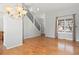 Bright living room features hardwood floors, large windows, and staircase to the second floor at 3339 Blue Grass Cir, Castle Rock, CO 80109
