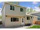 Beige two-story home features large windows and a back door for easy access at 17611 Hoyt Pl, Parker, CO 80134