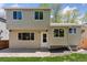 Beige home has large windows and a back door, perfect for entertaining and relaxing at 17611 Hoyt Pl, Parker, CO 80134
