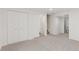 Finished basement features gray carpet, 2 closets and access to bath and stairway at 17611 Hoyt Pl, Parker, CO 80134