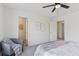 Bright, carpeted bedroom features a chair and doorway to another room at 17611 Hoyt Pl, Parker, CO 80134