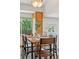 Dining area with views to backyard and seating for six at 17611 Hoyt Pl, Parker, CO 80134