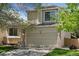 Inviting two-story home with a spacious two-car garage, brick accents and well-maintained lawn at 17611 Hoyt Pl, Parker, CO 80134