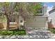 Lovely two-story home with attached garage, brick accents, and a well-maintained front lawn at 17611 Hoyt Pl, Parker, CO 80134
