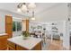 Eat-in kitchen with wood floors, white countertops, and stainless steel appliances leading to Gathering room at 17611 Hoyt Pl, Parker, CO 80134