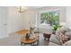 Cozy living room featuring a large window, plush seating, and stylish decor at 17611 Hoyt Pl, Parker, CO 80134