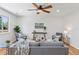 Comfortable living room features a ceiling fan, wood floors, and lots of natural light at 17611 Hoyt Pl, Parker, CO 80134