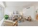 Bright and airy living room with neutral tones, vaulted ceiling and comfortable seating arrangement at 17611 Hoyt Pl, Parker, CO 80134