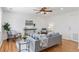 Bright living room features a ceiling fan, wood floors, and lots of natural light at 17611 Hoyt Pl, Parker, CO 80134