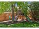 A backyard play structure featuring a slide, swing and rock climbing wall, for hours of outdoor fun at 17611 Hoyt Pl, Parker, CO 80134