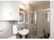 Bathroom featuring a pedestal sink and a glass-enclosed shower at 3004 S Niagara Way, Denver, CO 80224