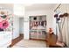 Bedroom featuring floral wallpaper and closet with organized storage at 3004 S Niagara Way, Denver, CO 80224