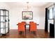 Bright dining room featuring modern lighting, four chairs, and stylish decor at 3004 S Niagara Way, Denver, CO 80224