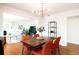 Open dining room with stylish lighting fixture and entry to the living area at 3004 S Niagara Way, Denver, CO 80224