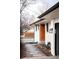 Modern home exterior with a stylish wood door, manicured landscaping and stepping stones at 3004 S Niagara Way, Denver, CO 80224