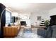 Inviting living room with a cozy seating area, fireplace, and view to the playroom at 3004 S Niagara Way, Denver, CO 80224