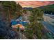 Panoramic view of mountain home and landscape with mature trees, and open space at 20951 Pleasant Park Rd, Conifer, CO 80433