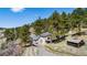 Beautiful home with multiple decks, detached garage and secondary cabin on a well-treed lot at 20951 Pleasant Park Rd, Conifer, CO 80433