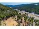 Expansive mountain property featuring rolling hills and horse pastures with easy road access at 20951 Pleasant Park Rd, Conifer, CO 80433