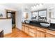 Bright bathroom featuring double sinks, wood cabinets, granite countertops, and walk-in shower at 20951 Pleasant Park Rd, Conifer, CO 80433