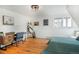 Bedroom featuring hardwood floors, a desk, and serene natural light at 20951 Pleasant Park Rd, Conifer, CO 80433