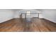 A bonus room with wood floors, railing, and window for lots of natural light at 20951 Pleasant Park Rd, Conifer, CO 80433