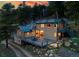 Inviting home with a metal roof, a spacious deck for entertaining, and a rustic setting, blending comfort and natural beauty at 20951 Pleasant Park Rd, Conifer, CO 80433