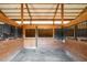 Spacious horse stalls with wooden dividers in barn at 20951 Pleasant Park Rd, Conifer, CO 80433