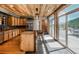 Modern kitchen with granite countertops, wood cabinets, stainless steel appliances, and an island at 20951 Pleasant Park Rd, Conifer, CO 80433