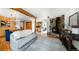 Open concept living space seamlessly connects dining area, fireplace, and kitchen at 20951 Pleasant Park Rd, Conifer, CO 80433